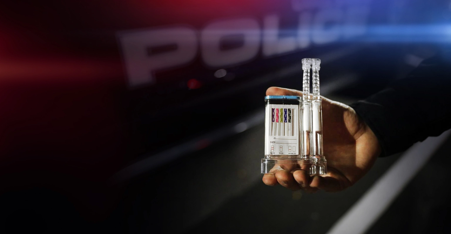Officer using an oral fluid drug test during DUI roadside enforcement